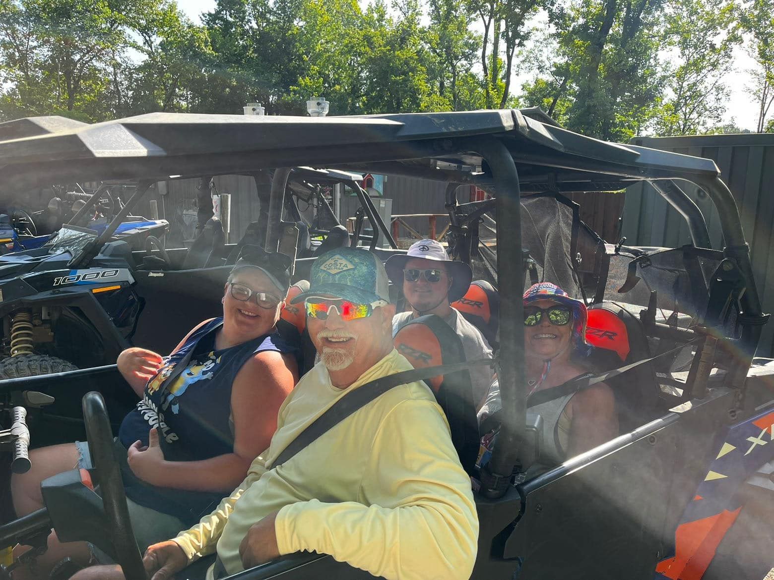 A group of people are sitting in a vehicle.
