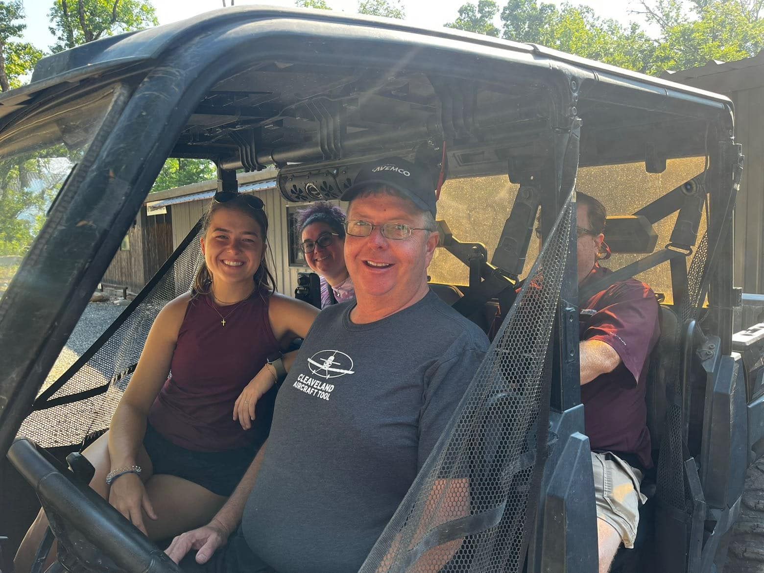 A group of people are sitting in a vehicle.