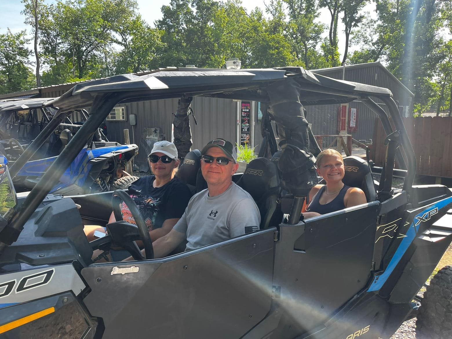 A group of people are sitting in a vehicle.