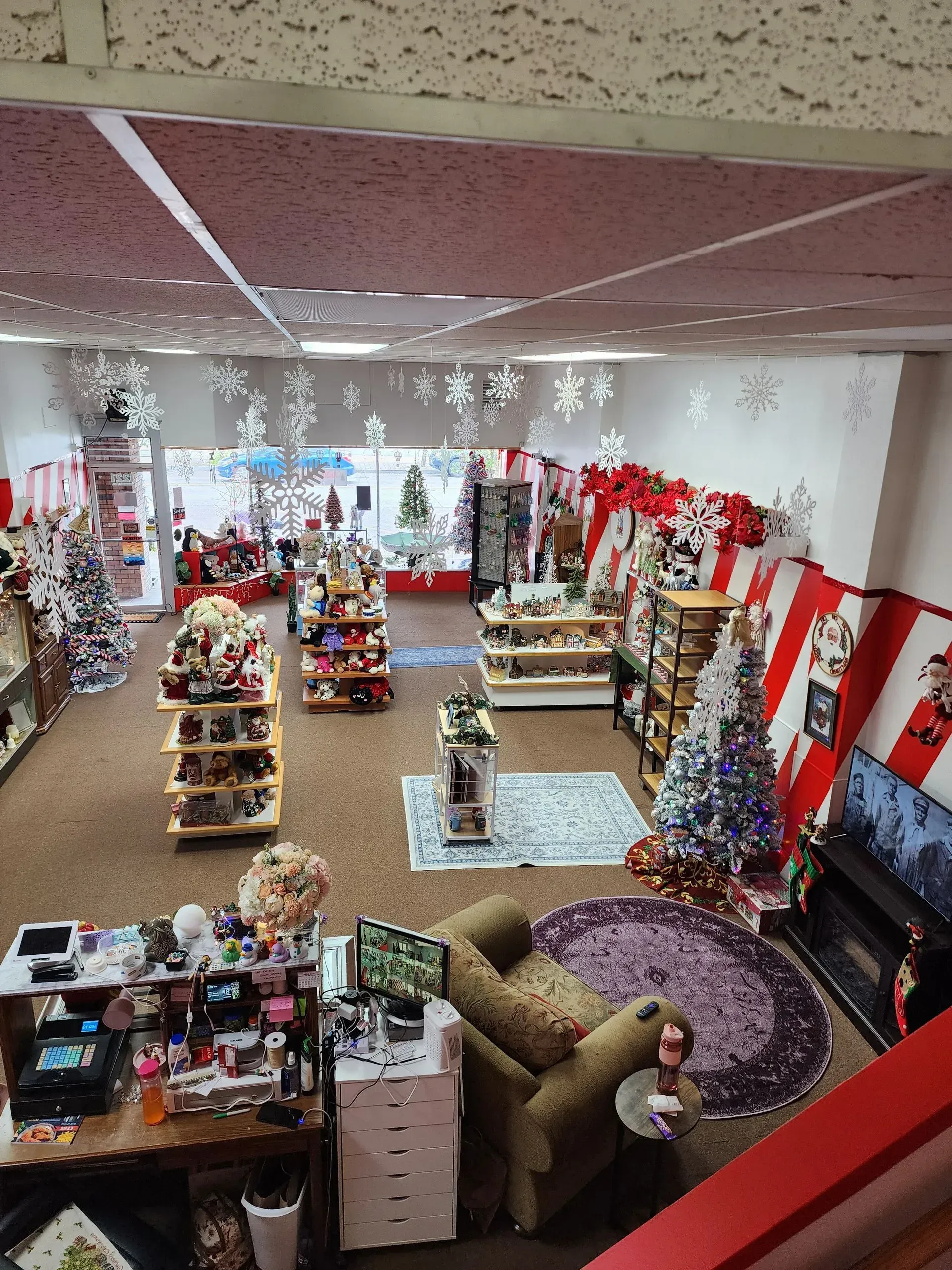 A store decorated for the holidays, featuring displays of gifts and decorations.