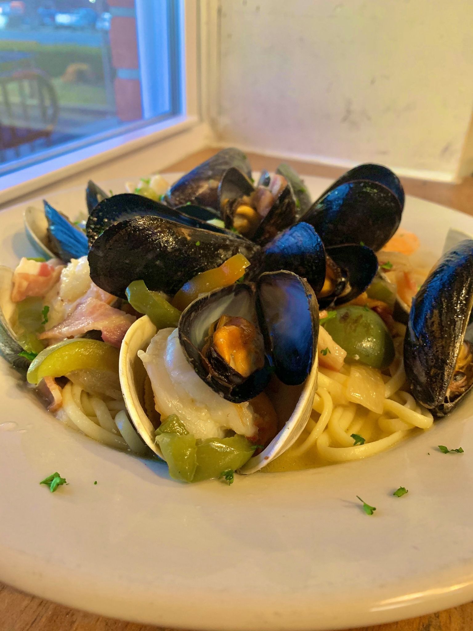 Clams and Mussels over linguine