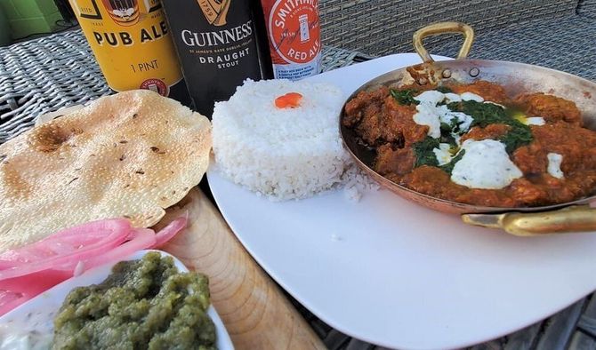 Traditional curry with rice and naan bread