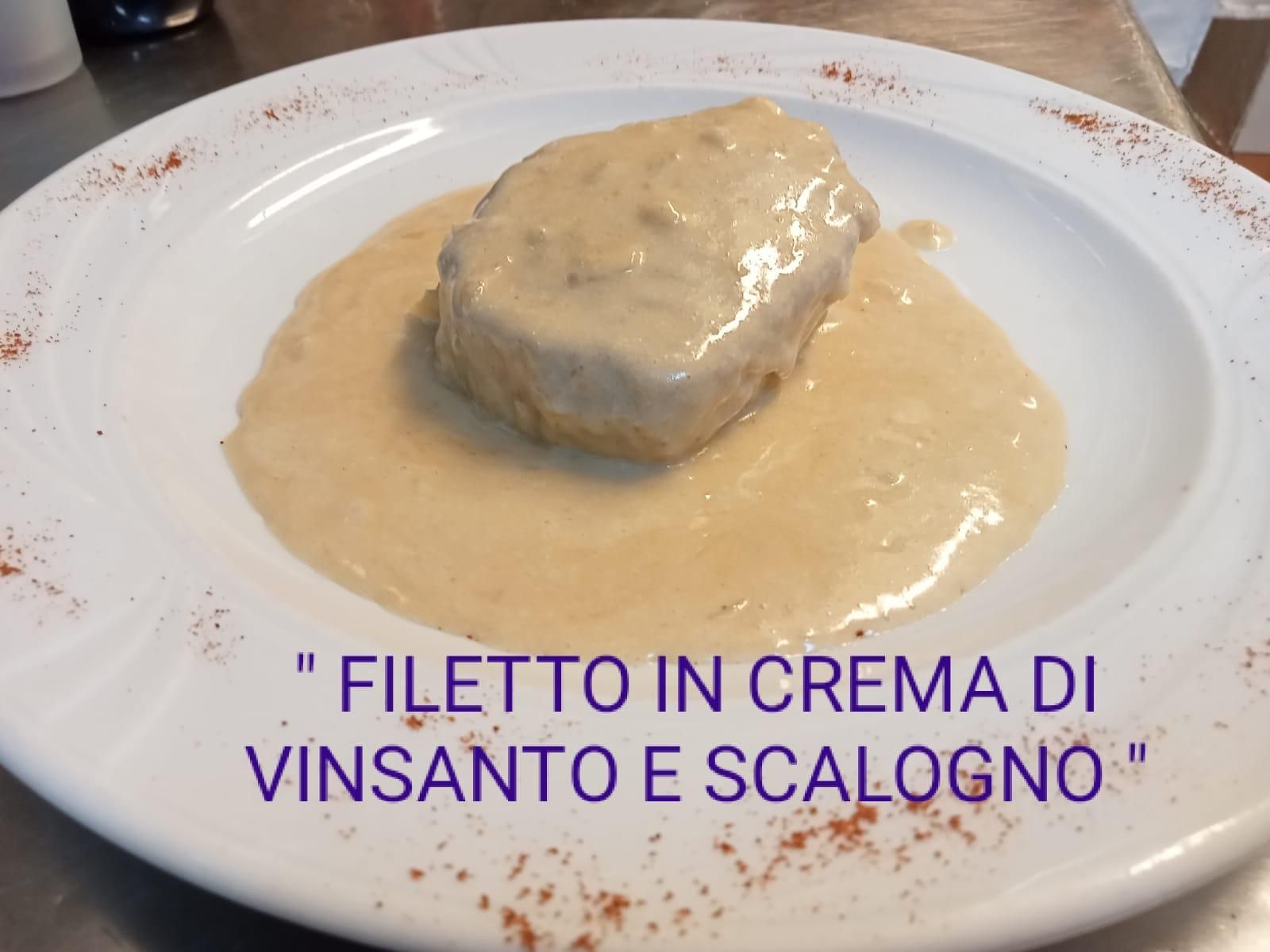Filetto in crema di vinsanto e scalogno is on a white plate