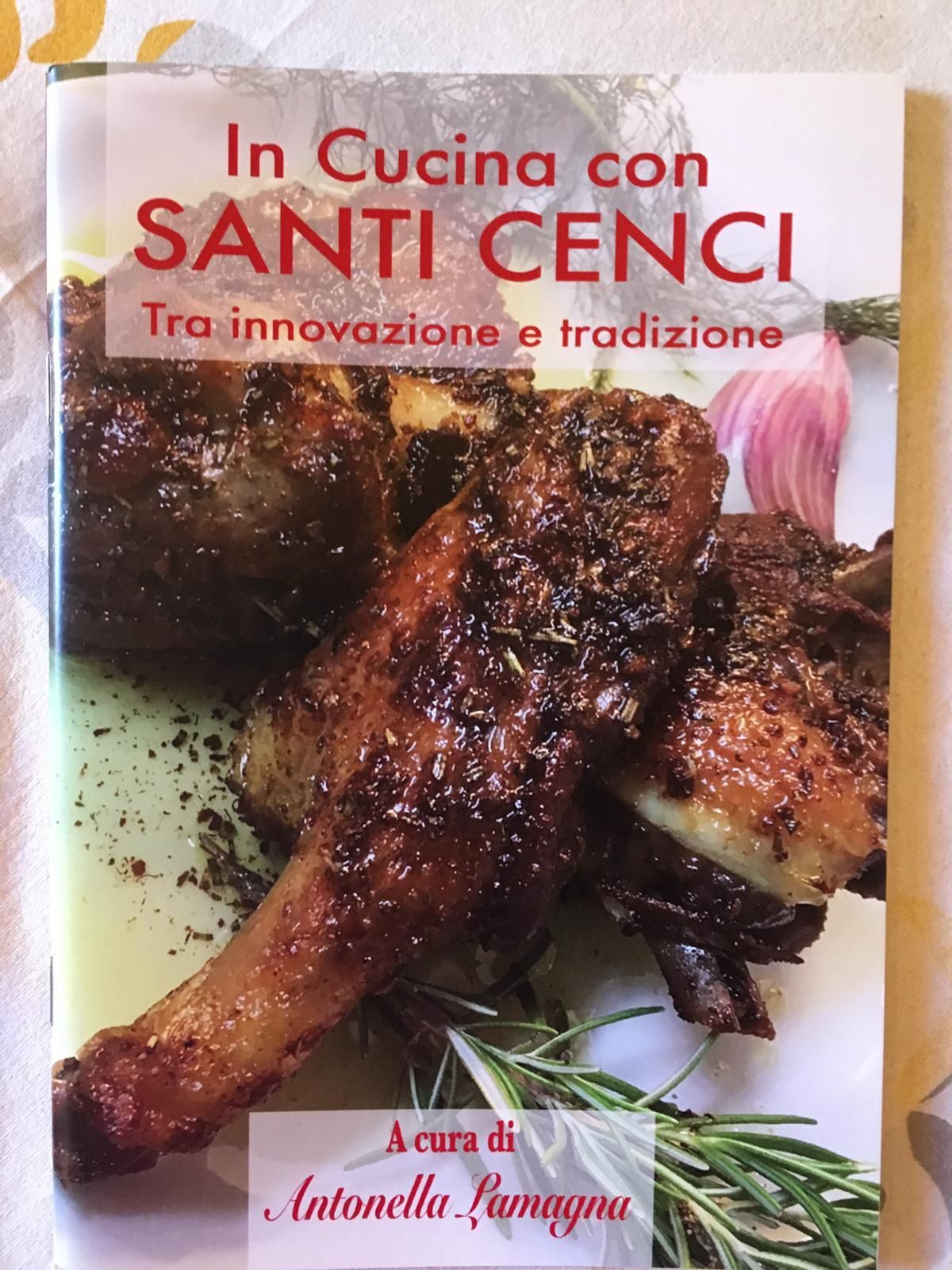 A book titled in cucina con santi cenci