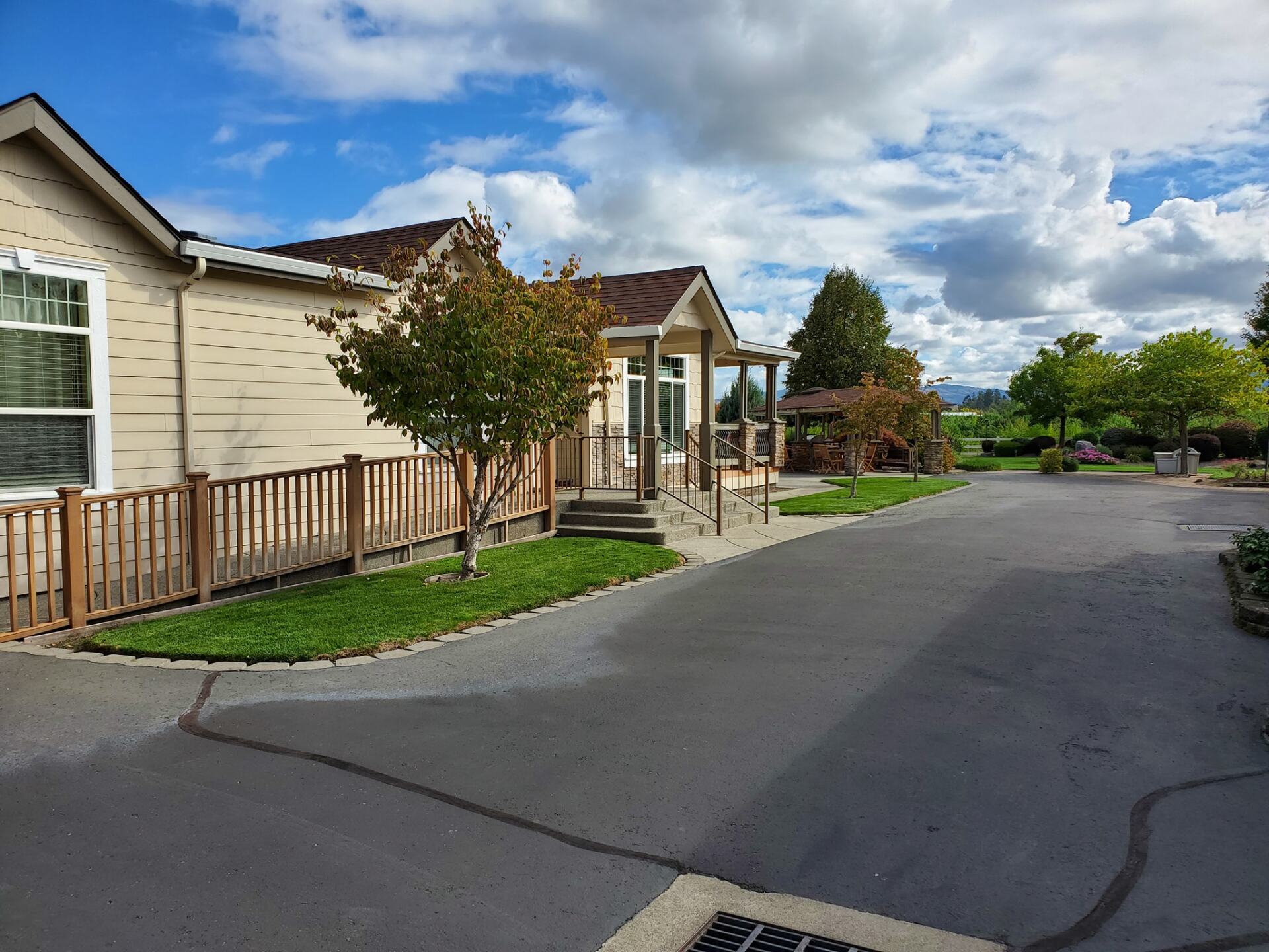 Front Yard Of Cream Tainted House — Medford, Oregon — Springfall Landscape & Maintenance