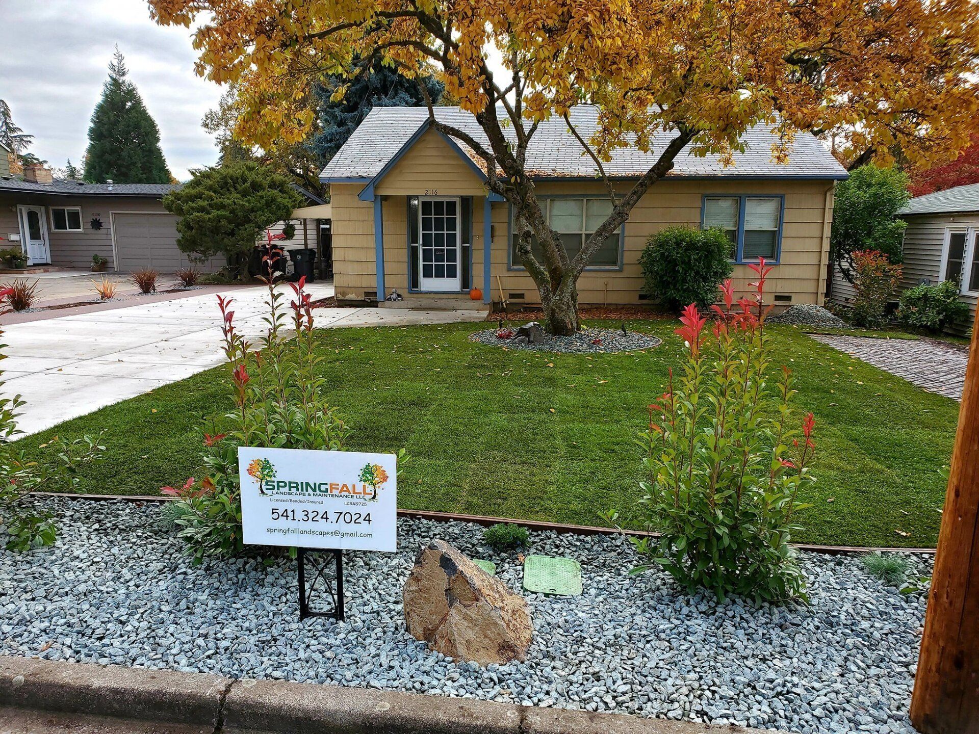 Front View Of Light Brown House With Plants — Medford, Oregon — Springfall Landscape & Maintenance