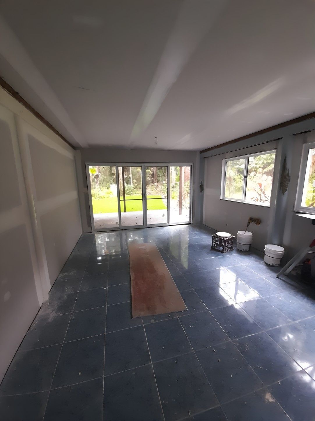 A Large Empty Room With a Lot of Windows — Barrington Coast Contracting in Minimbah, NSW