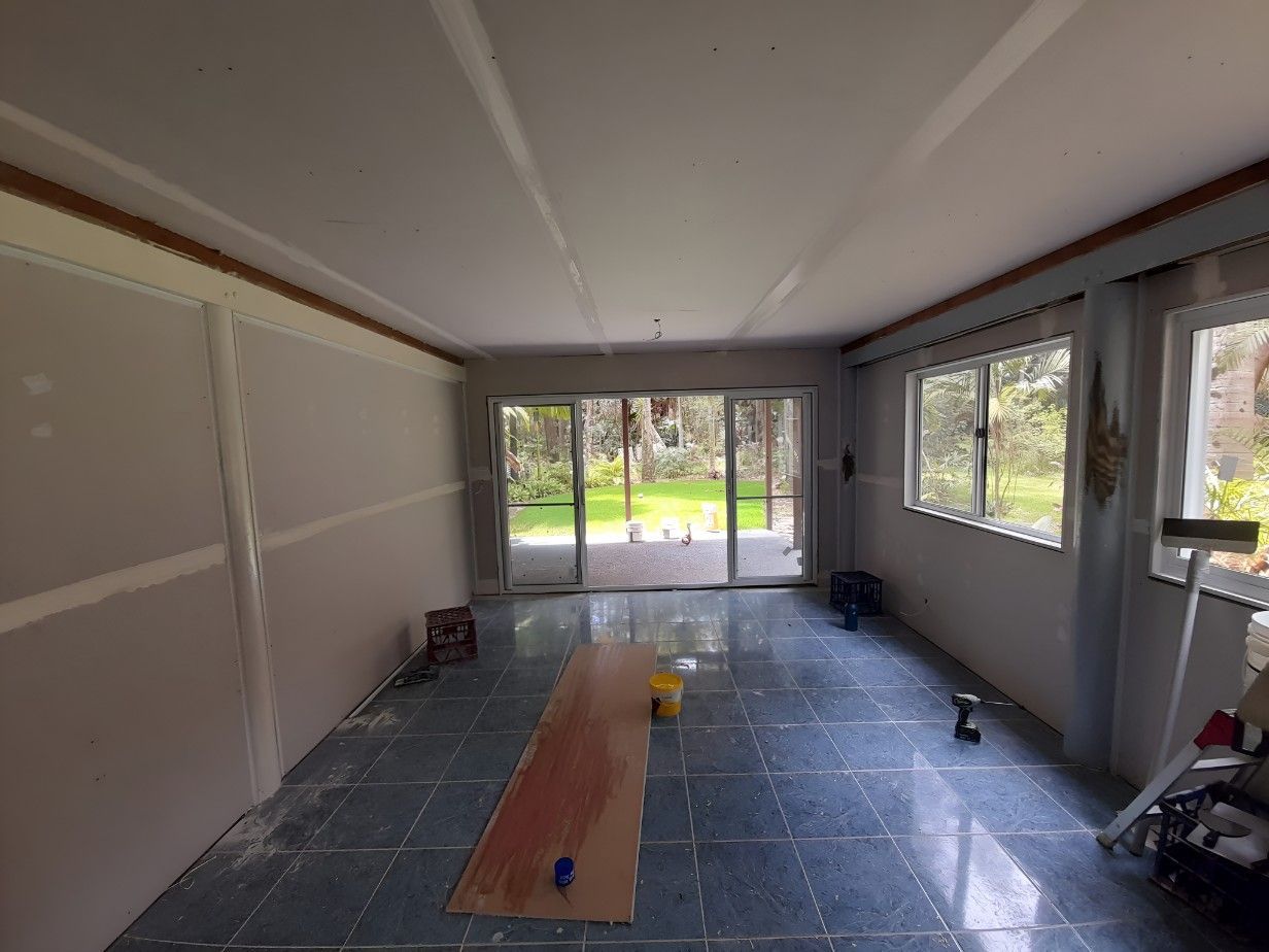 A Room With a Lot of Windows and a Glass Door — Barrington Coast Contracting in Minimbah, NSW