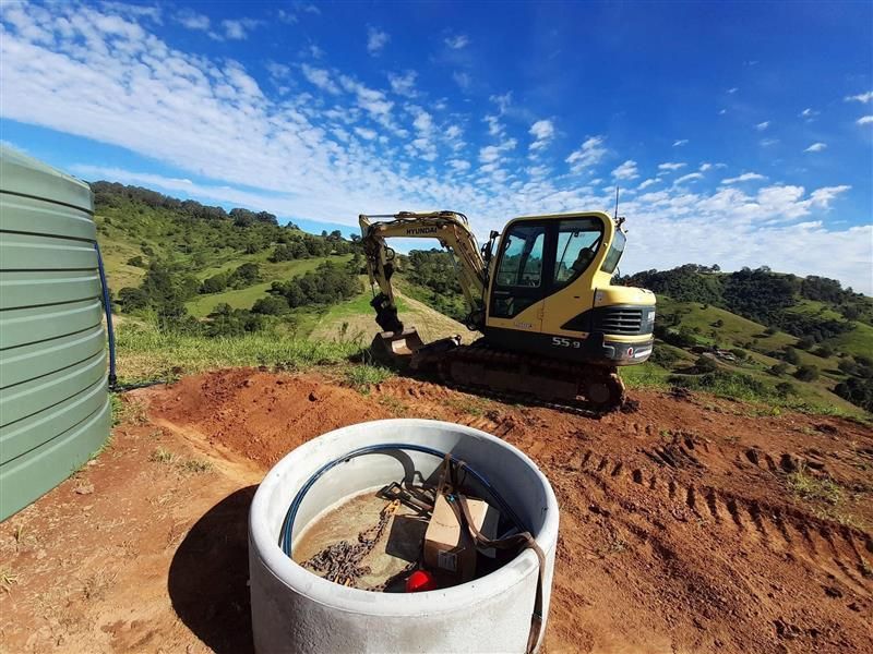 A Man is Working on a Piece of Metal on a Dirt Road — Barrington Coast Contracting in Minimbah, NSW