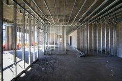 An empty building under construction with a lot of metal frames.