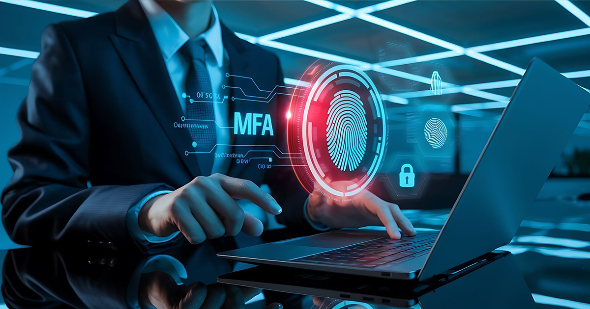 A man in a suit and tie is using a laptop computer.