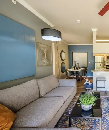 A living room with a couch and a coffee table at 23Hundred Ridgeview.
