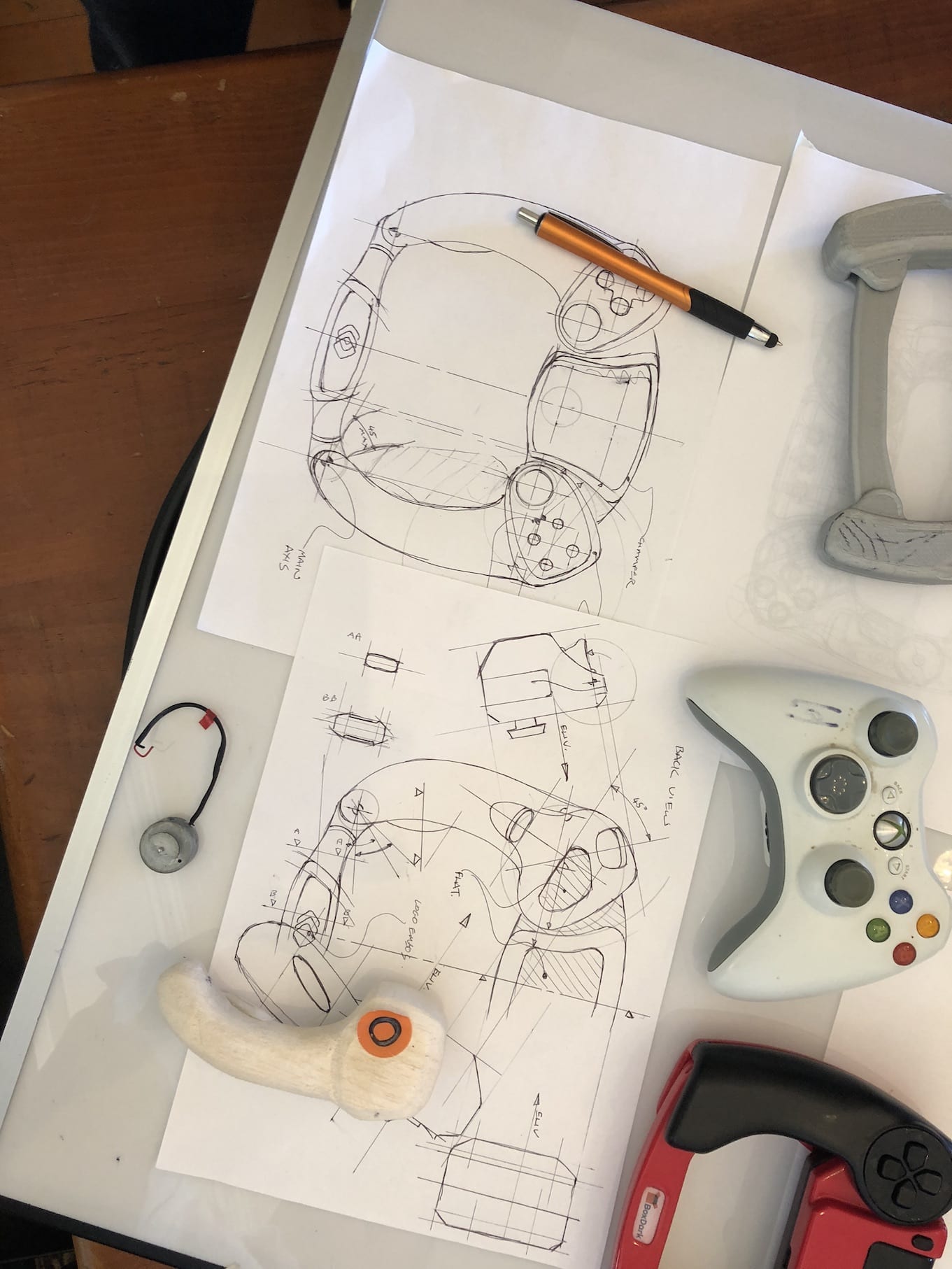 A drawing of a video game controller on a piece of paper