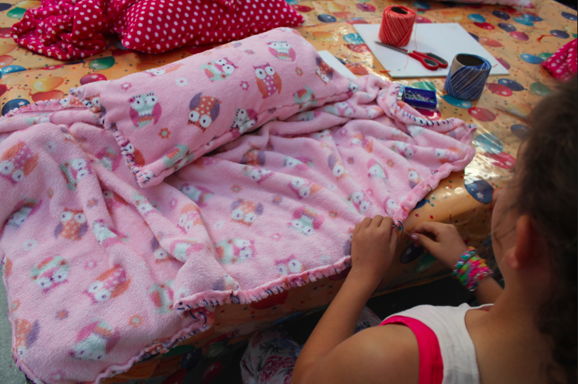 Young girl at a sewing workshop