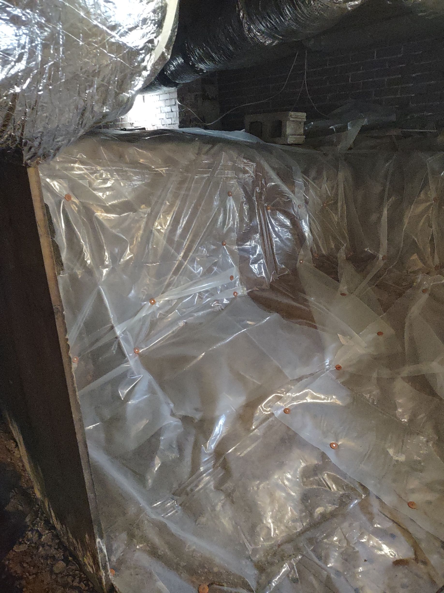 Clear plastic covering ductwork, likely for protection.