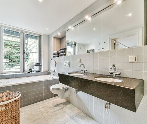 A kitchen with wooden cabinets and stainless steel appliances