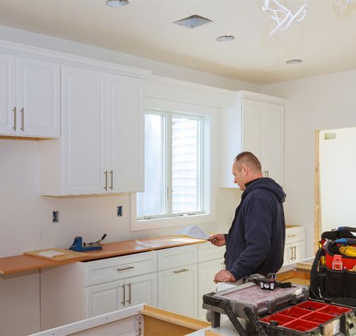 A kitchen with wooden cabinets and stainless steel appliances