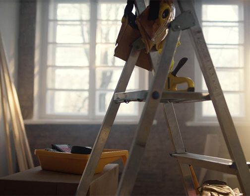 A kitchen with wooden cabinets and stainless steel appliances