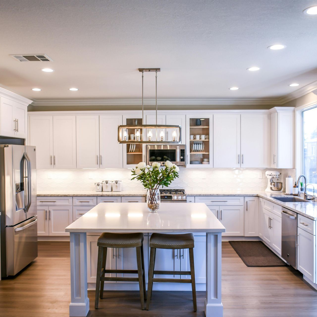 A kitchen with wooden cabinets and stainless steel appliances