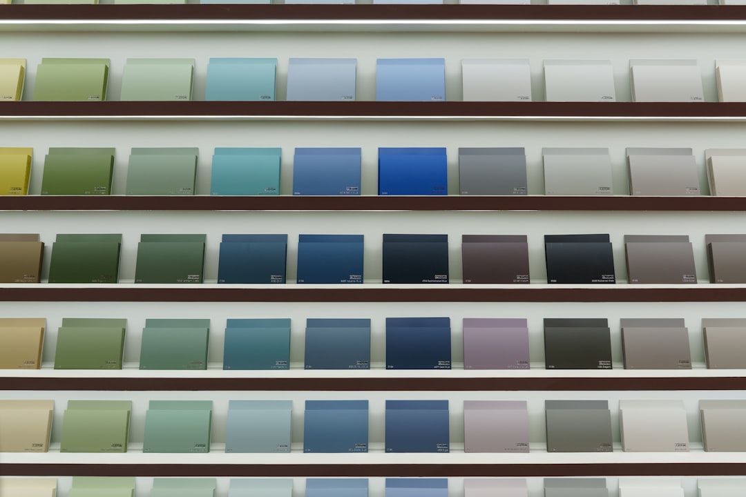 Various material samples for custom closet cabinetry, including wood grains, laminates, and solid colors, laid out for selection - custom closet cabinetry