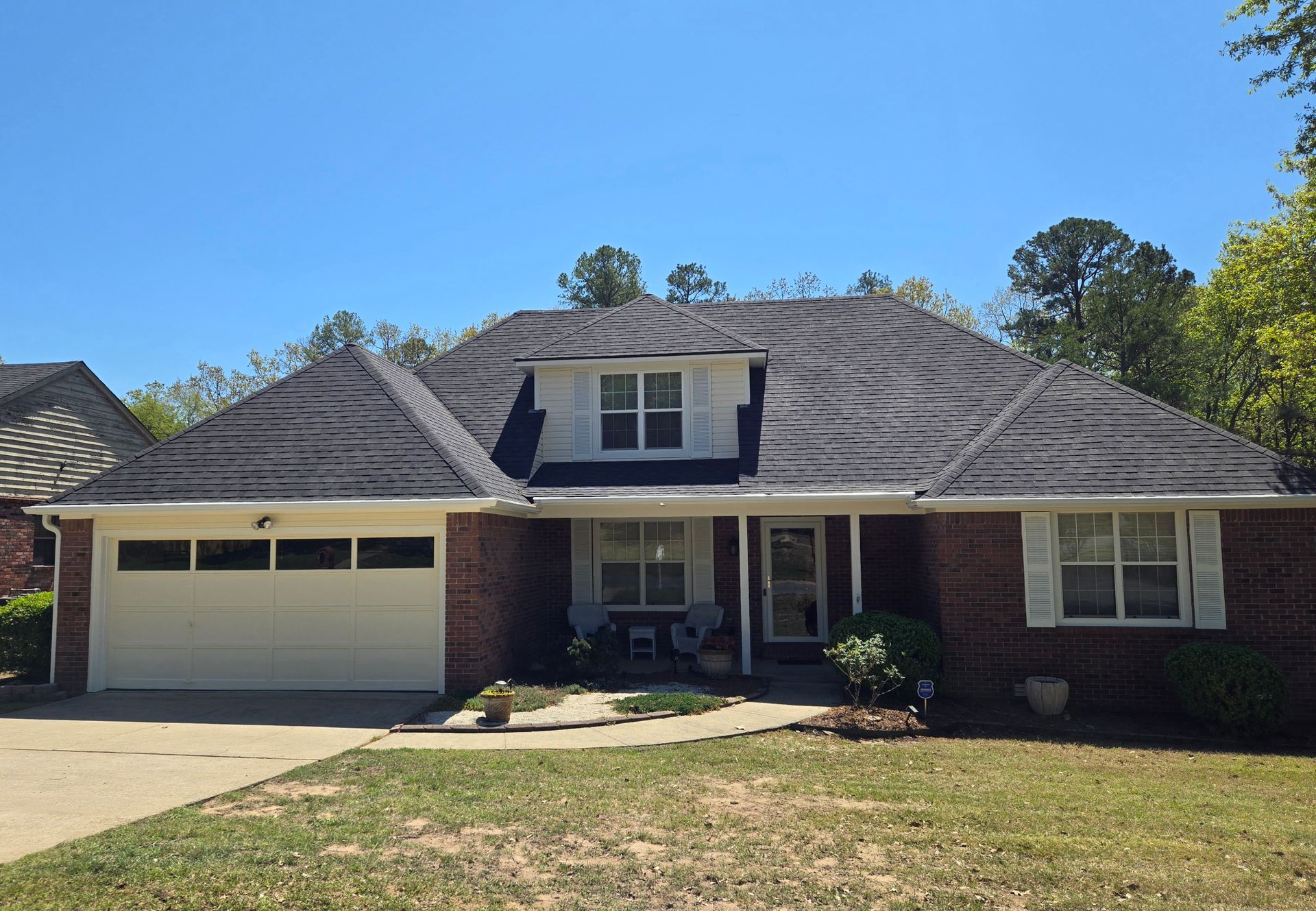 CertainTeed Landmark architectural in Moire Black. 6” seamless gutters and downspouts in white. House painted in Sherwin Williams ‘Morning Sun’. All trim painted in Sherwin Williams ‘Westhighland White’