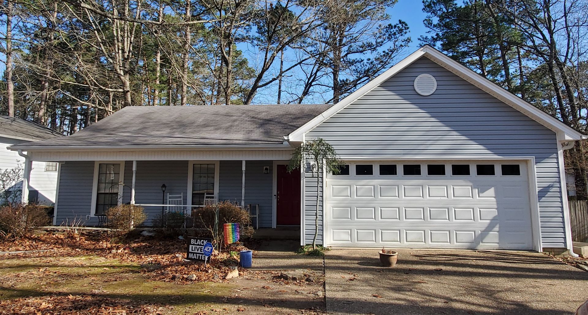 Royal Crest Dutchlap vinyl siding in Blue Gray. 5” seamless gutters and downspouts in white