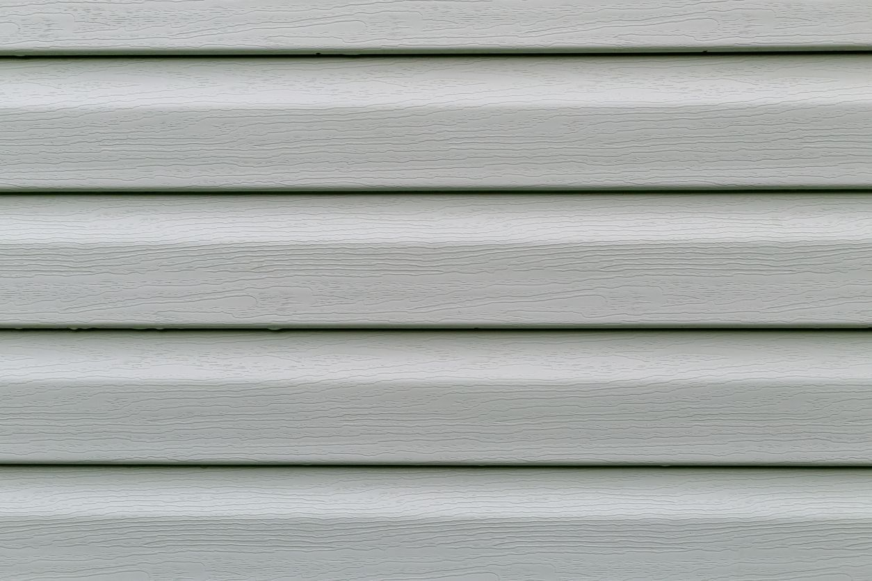 A close up of a white siding on a house.