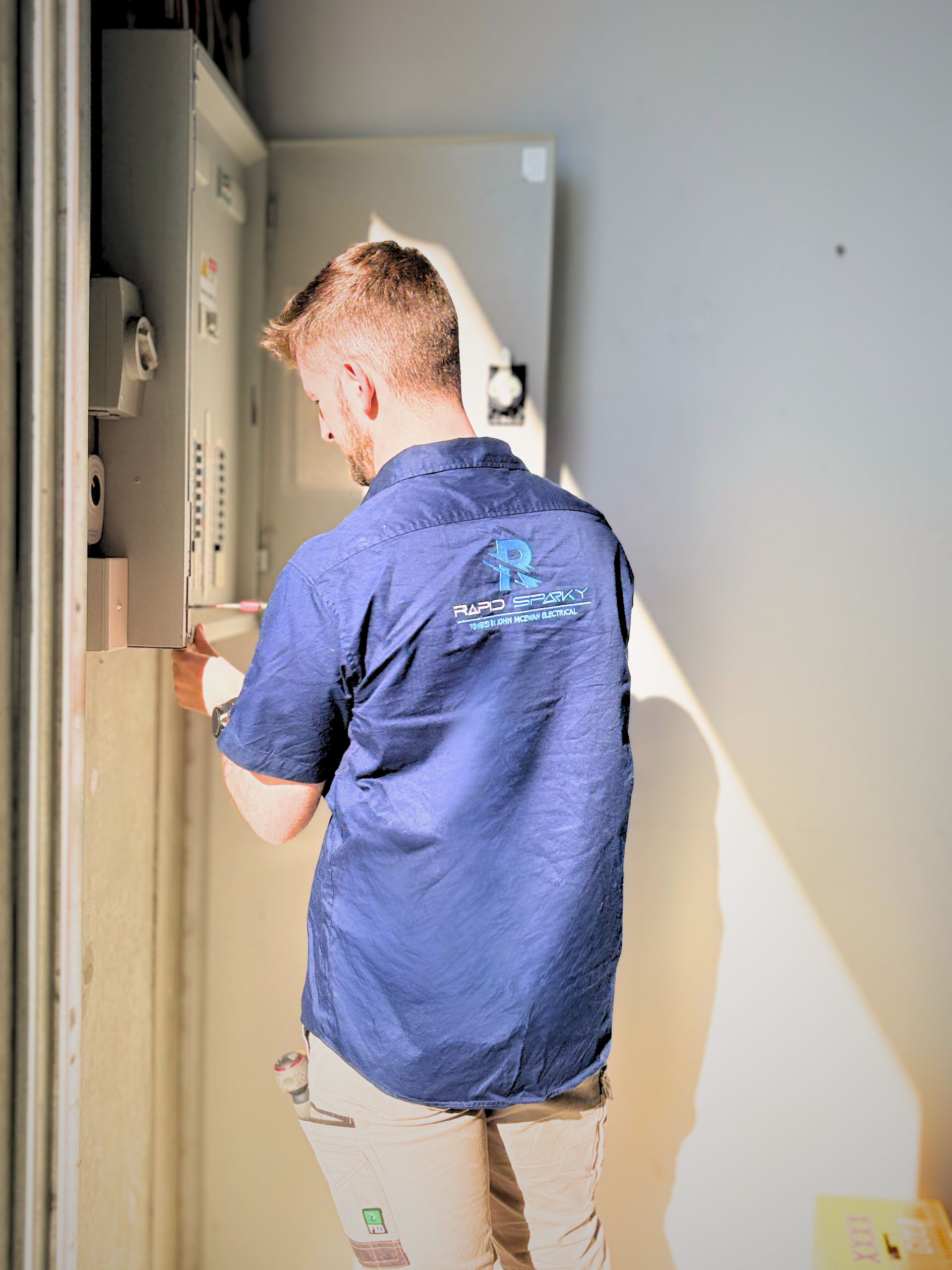 Electrician Fixing A Switchboard