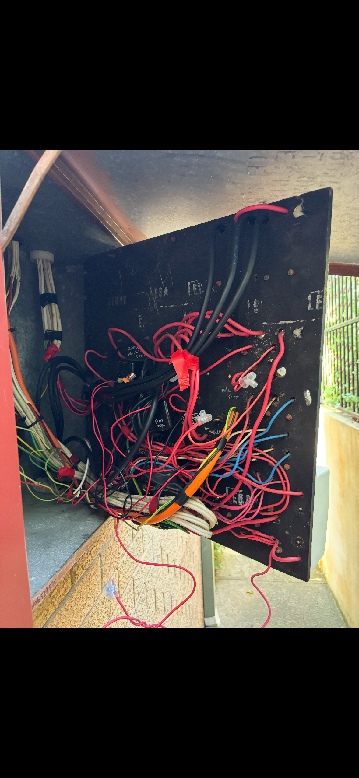 Electrical wires hanging from a door — Rapid Sparky in Wollongong, NSW 