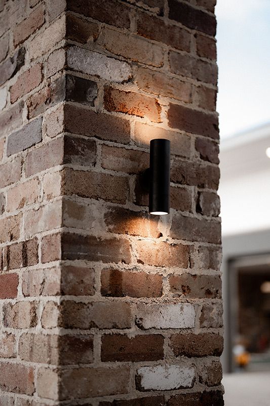 A Brick Wall With a Light on the Side of It — Rapid Sparky in Woonona, NSW