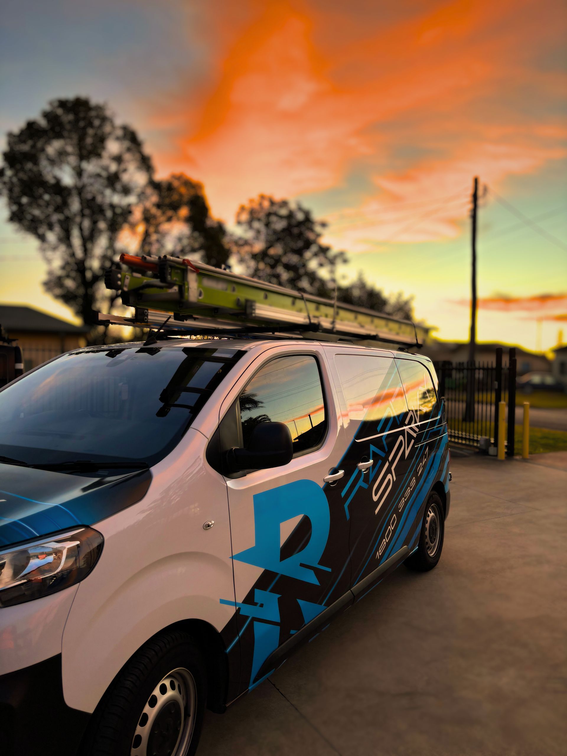 A van with rapid sparky written on it and the sunset behind — Rapid Sparky in Dapto, NSW