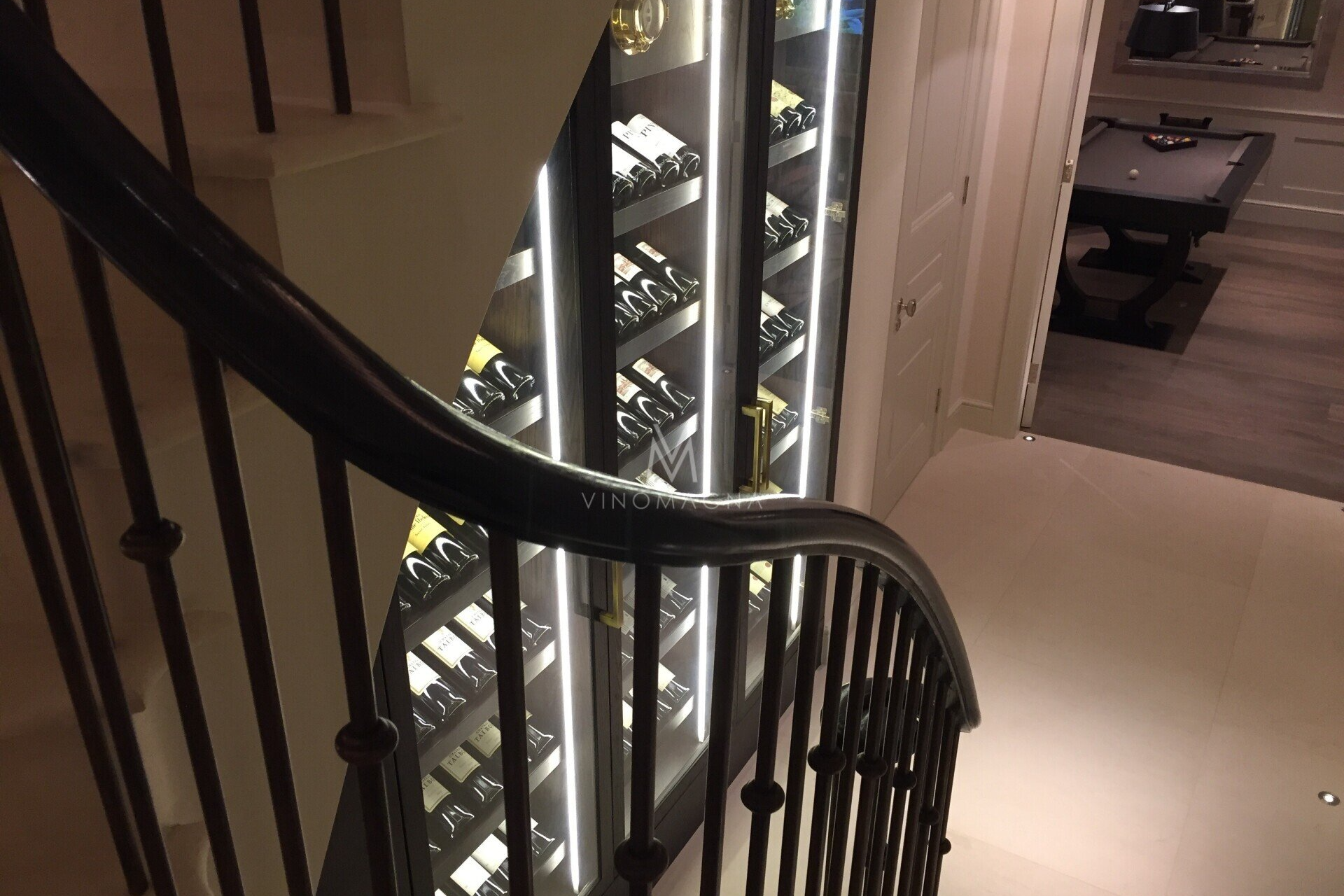 Vinomagna Under stairs custom wine display view from stairs