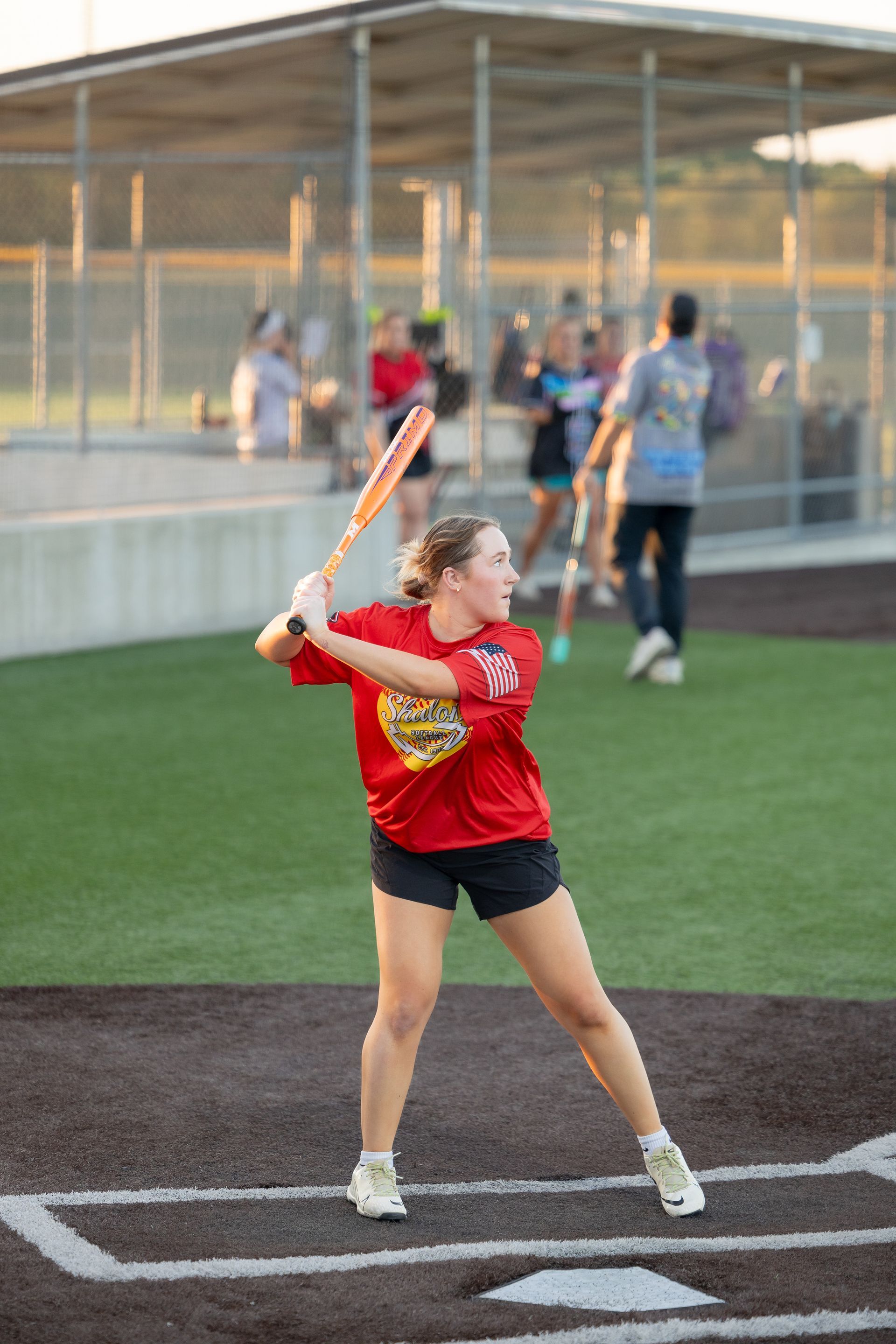 Female at bat for a Co-Rec softball game.