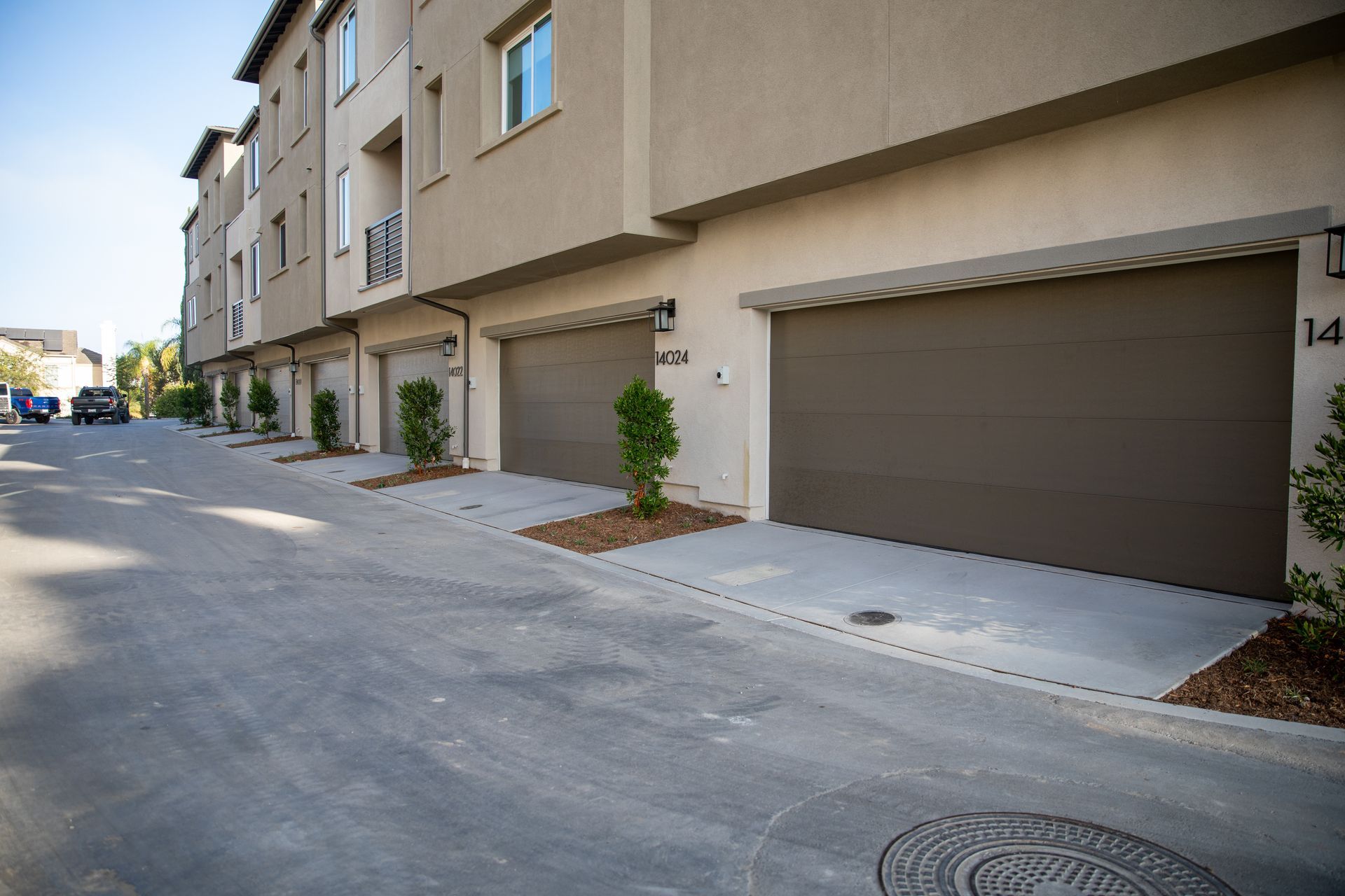 A row of garage doors on the side of a building.