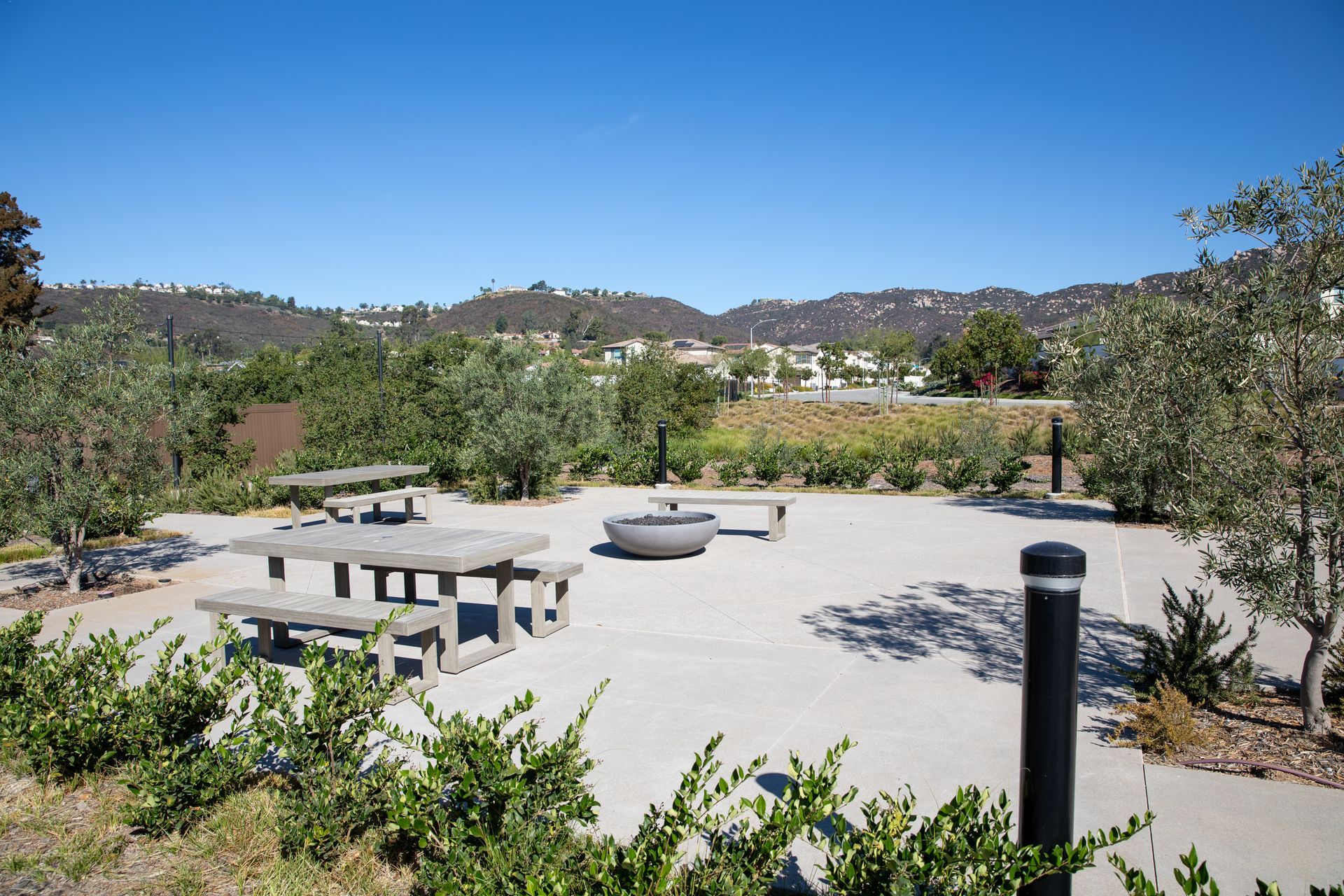 A picnic area with tables and benches in a park