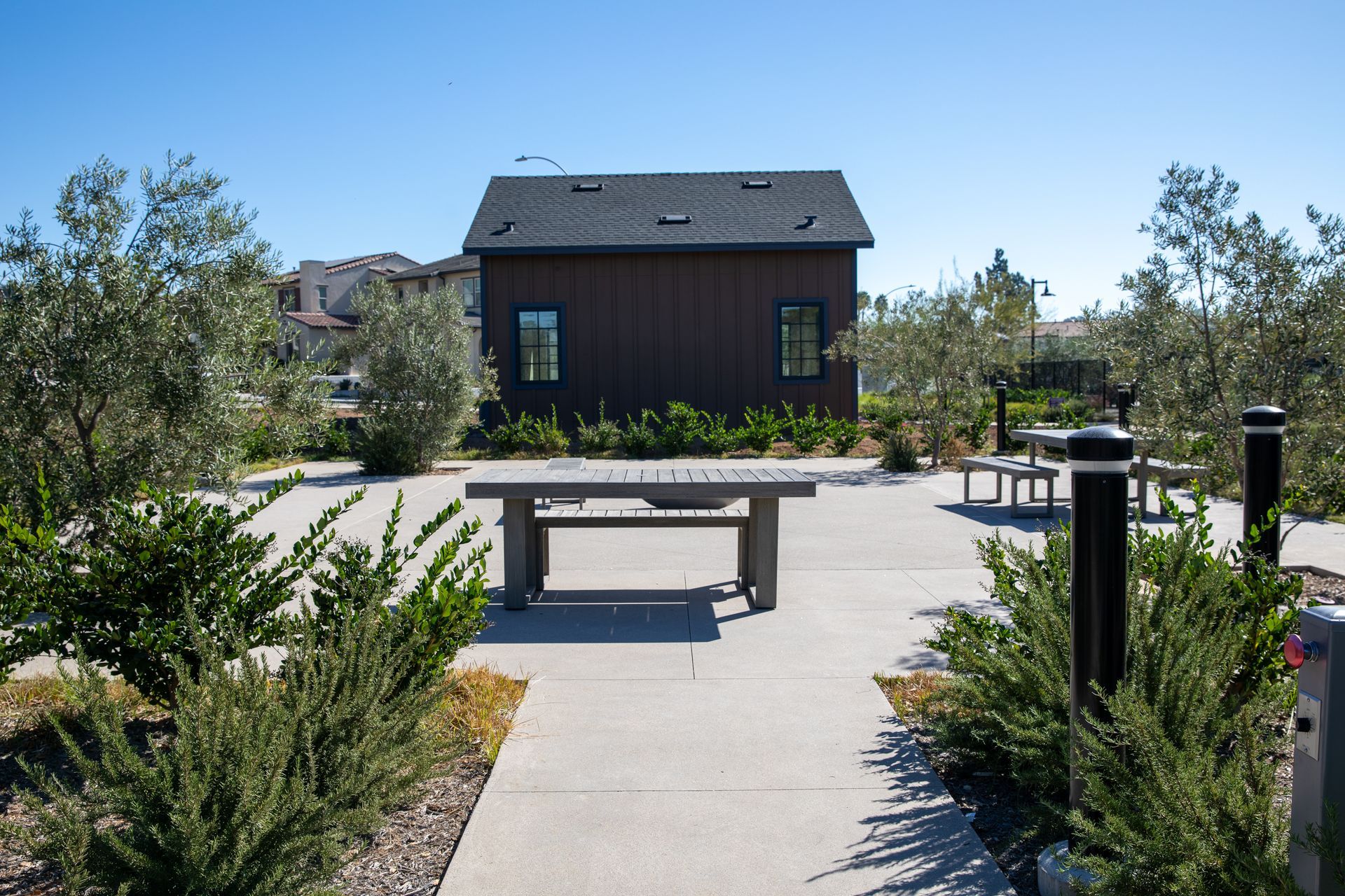 A small house with a picnic table in front of it