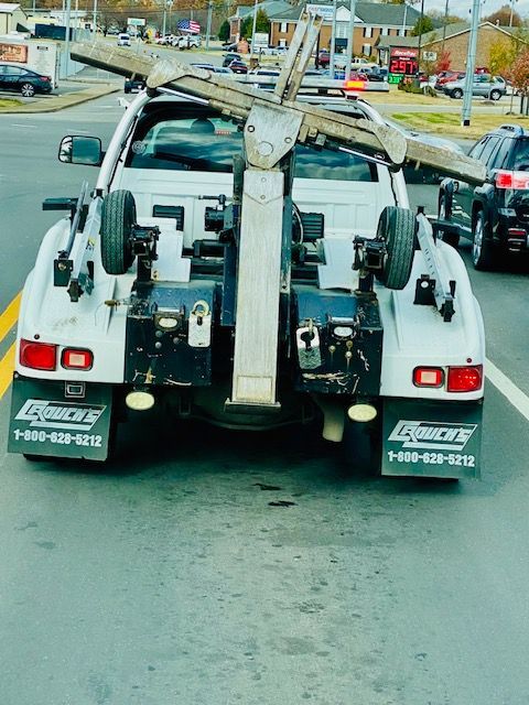 A tow truck with the number 73 on the back