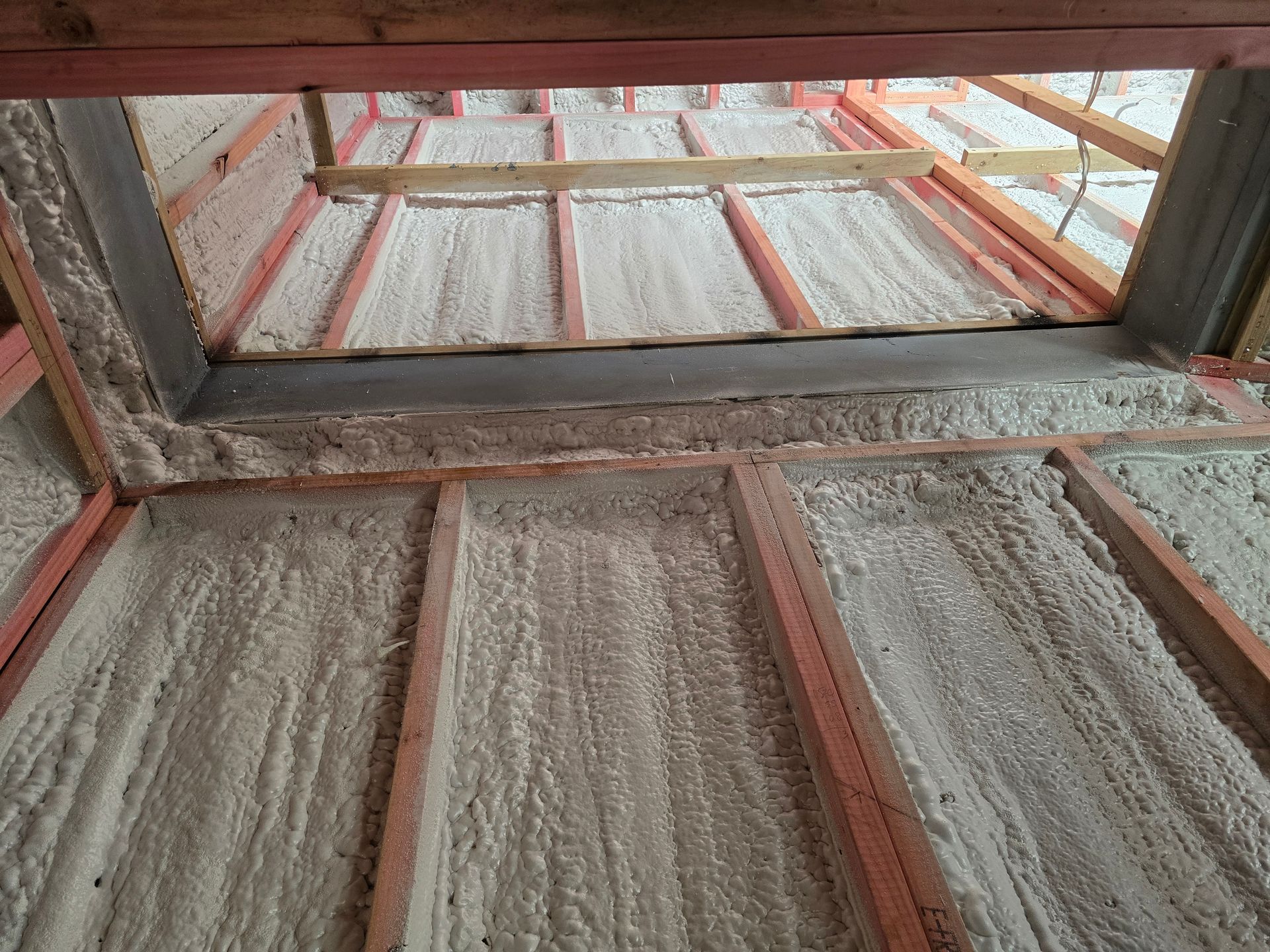 A room with a window and a lot of foam on the floor.