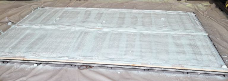 A large piece of wood is sitting on top of a table.