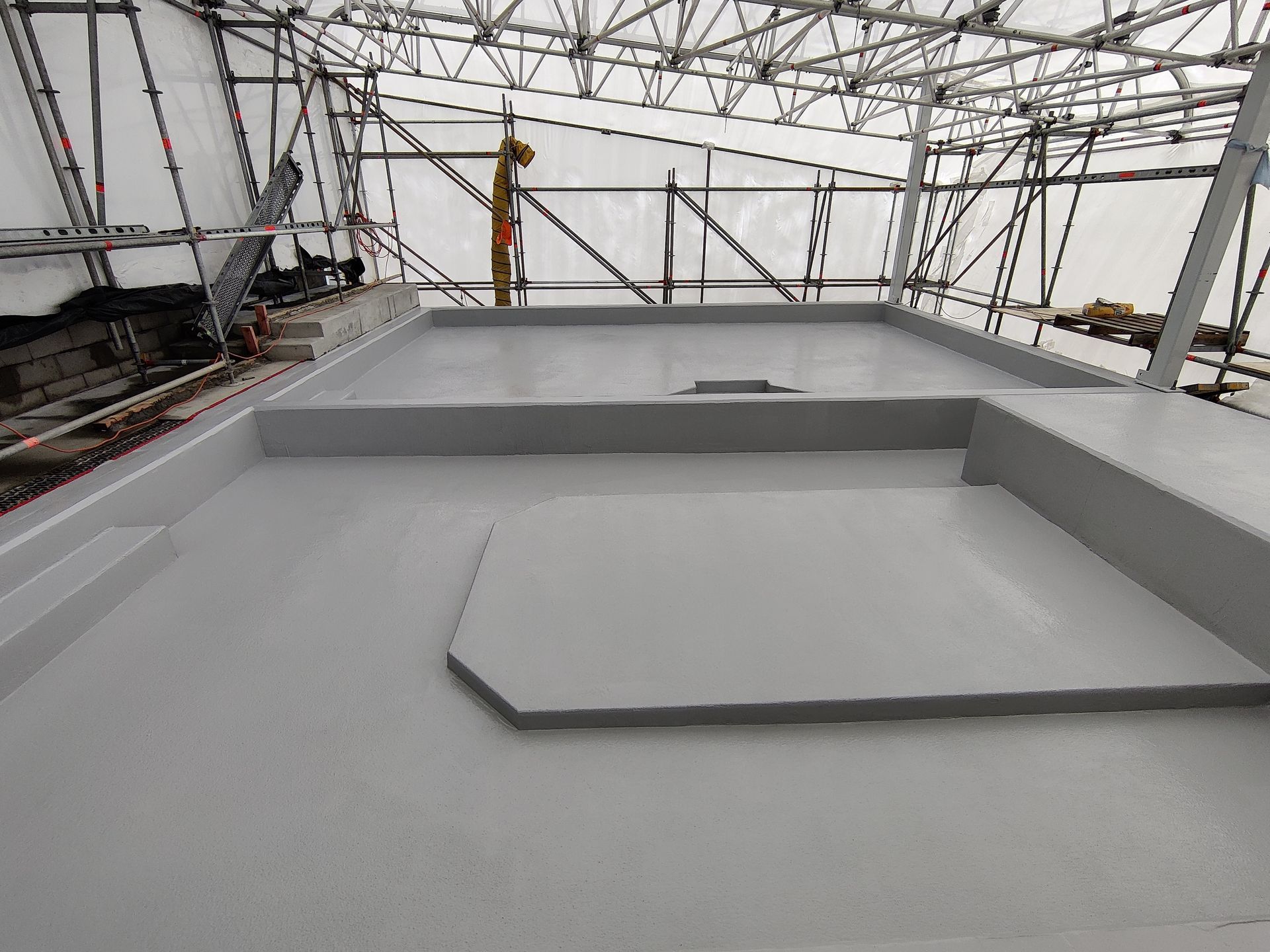 A roof with scaffolding on it is being built.