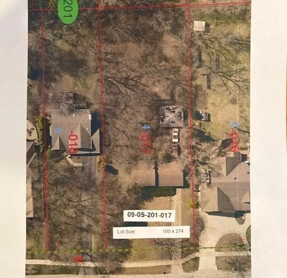 An aerial view of a lot with houses and trees