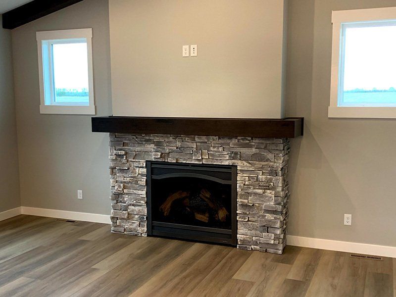 fireplace with wooden mantle