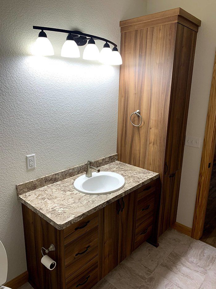 bathroom sink with light fixture overhead
