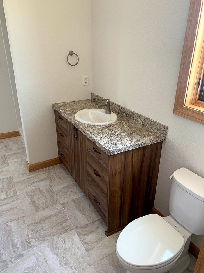 bathroom sink next to toilet