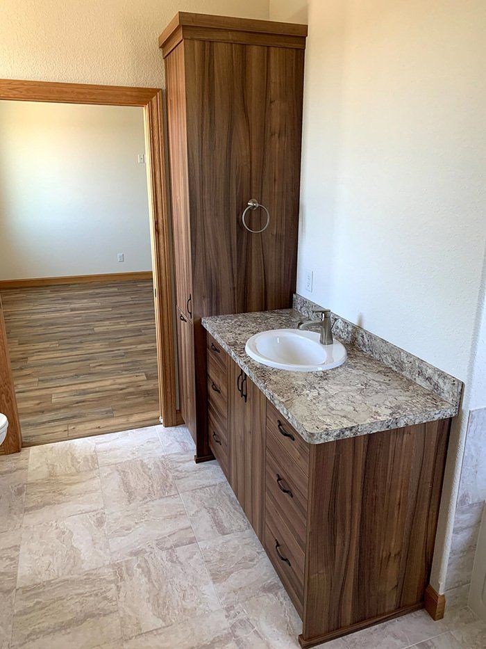 bathroom sink and tall cabinet