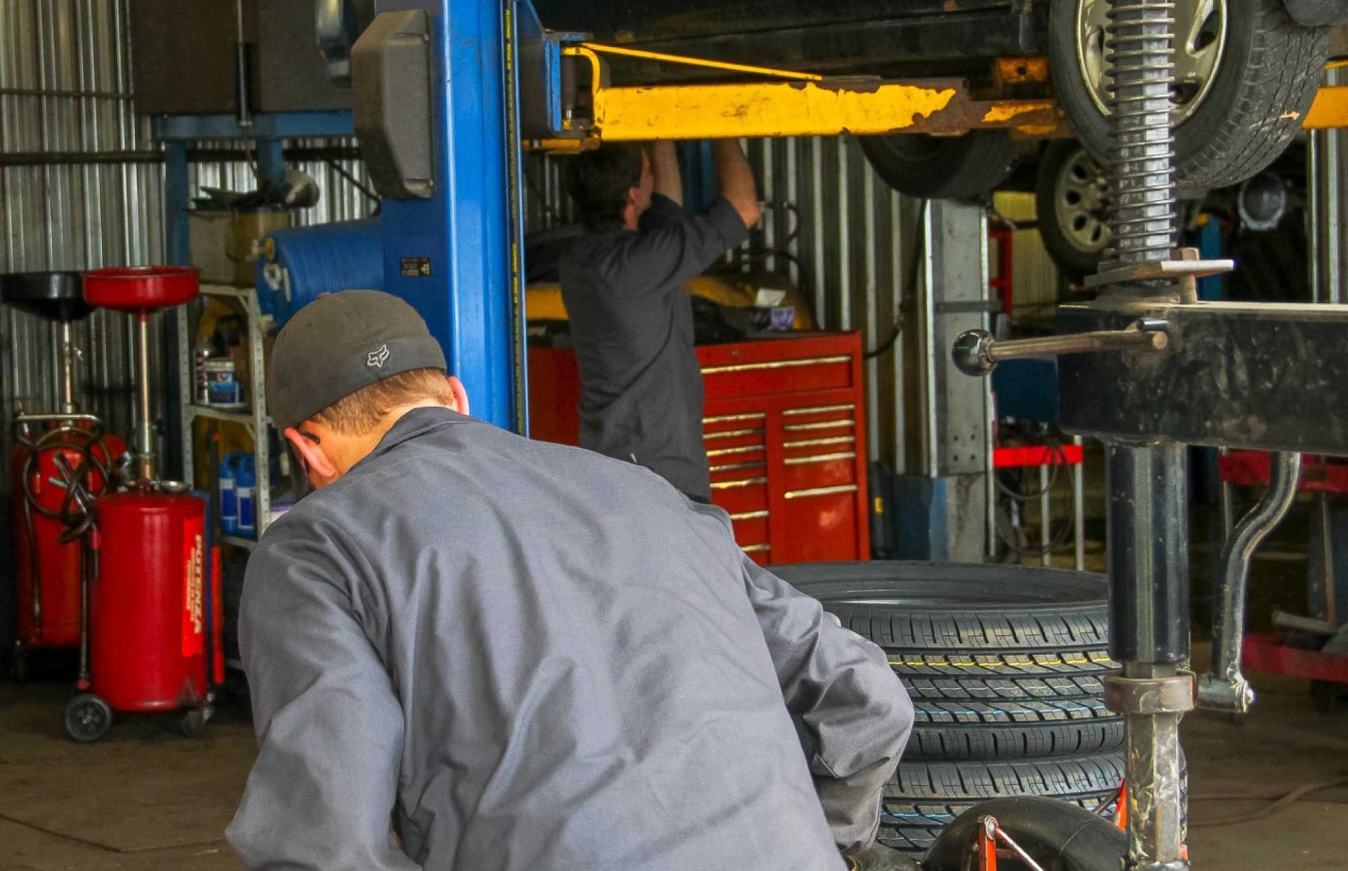 mechanics busy at car service station