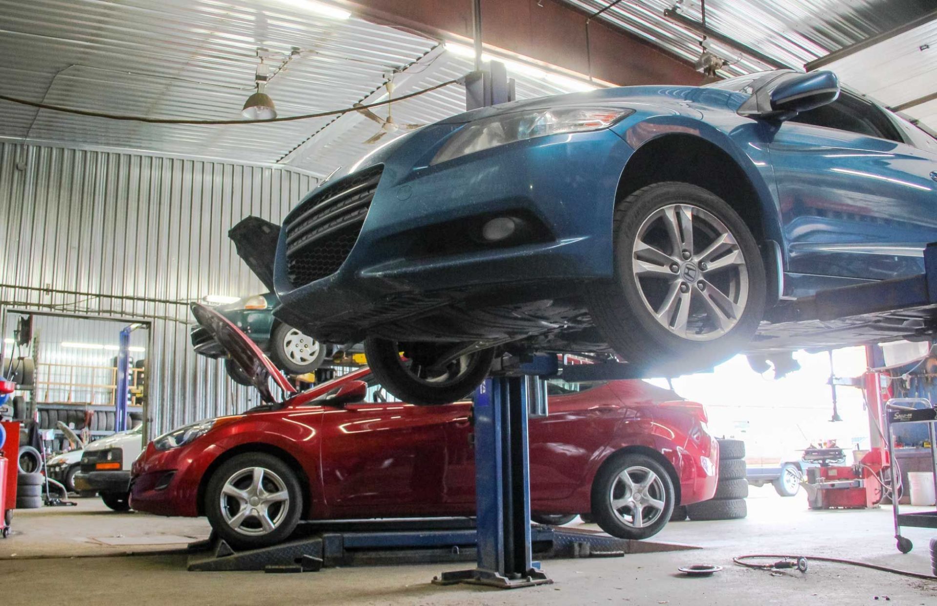 Cars are being serviced in service station and equipments