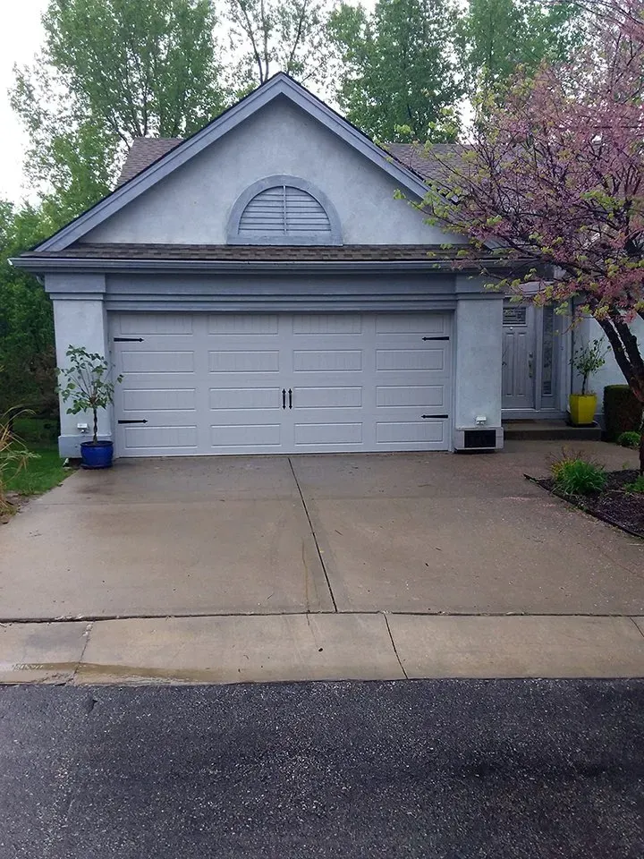 A house with a large garage and a driveway