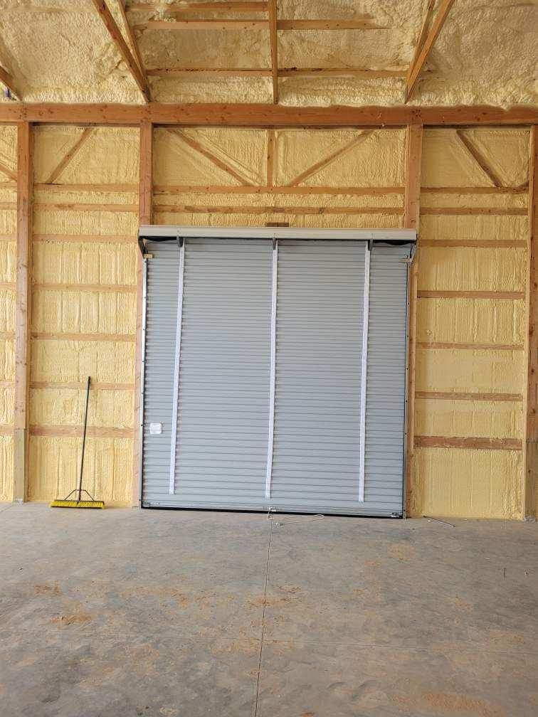 There is a garage door in the middle of the room.