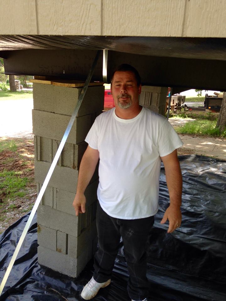 Man Standing Beneath the House — Tecumseh, OK — Jacks Mobile Home Service